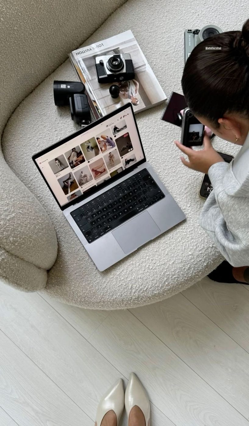 Planning a shoot: a laptop of references, cameras and a magazine